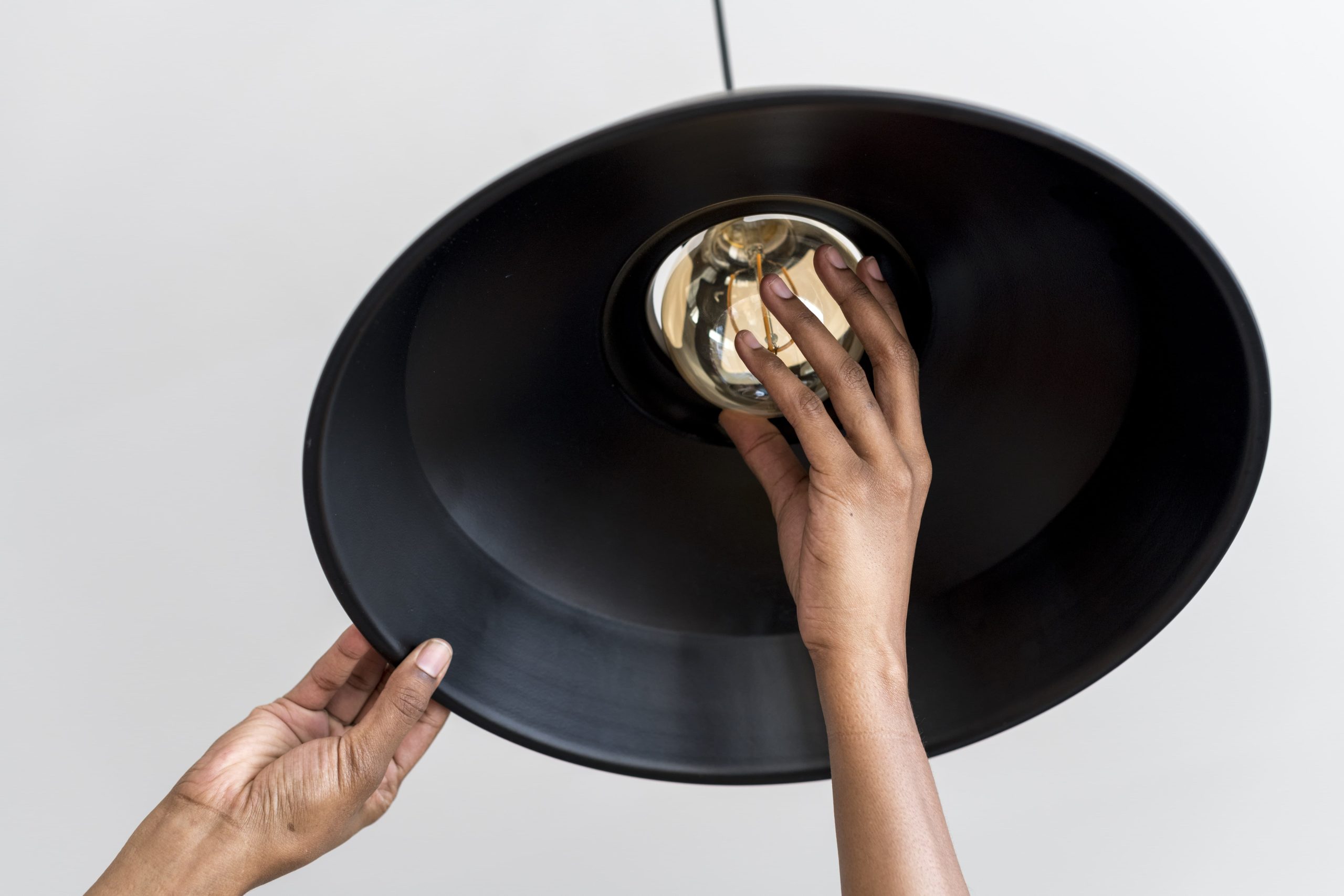 Home woman changing ligh tbulb min min